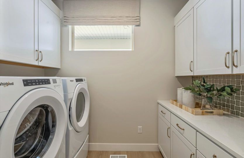 Functional Laundry Space with Cabinets