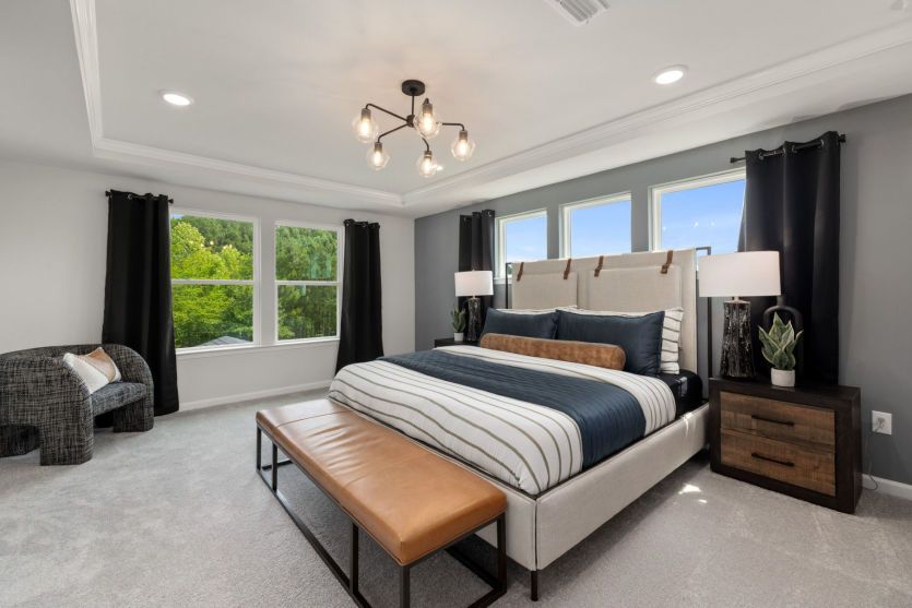 Natural Light fills this Roomy Owner's Suite - Model Representation
