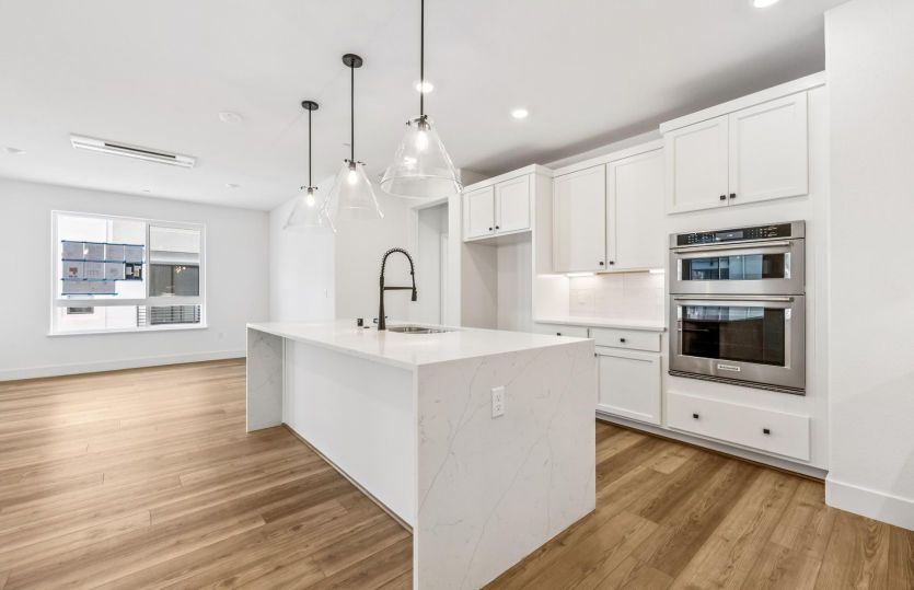Kitchen with large waterfall edge island