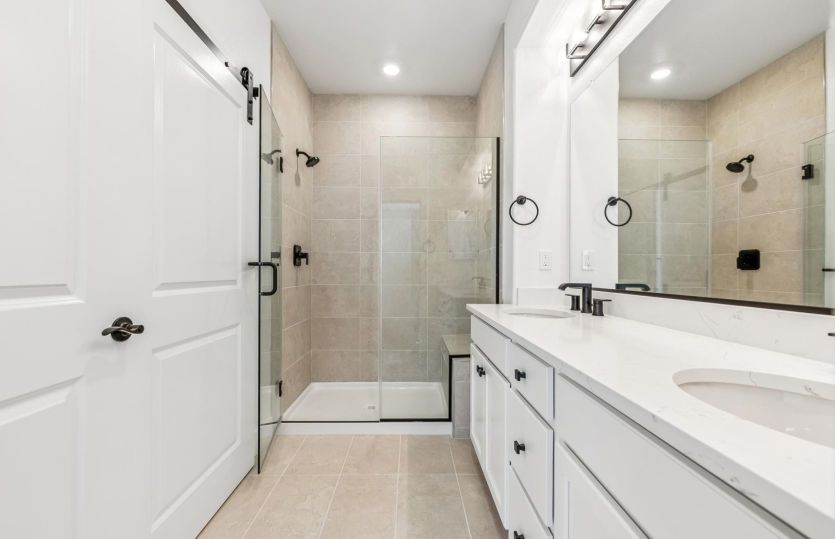 Primary bath with dual vanities and walk-in shower