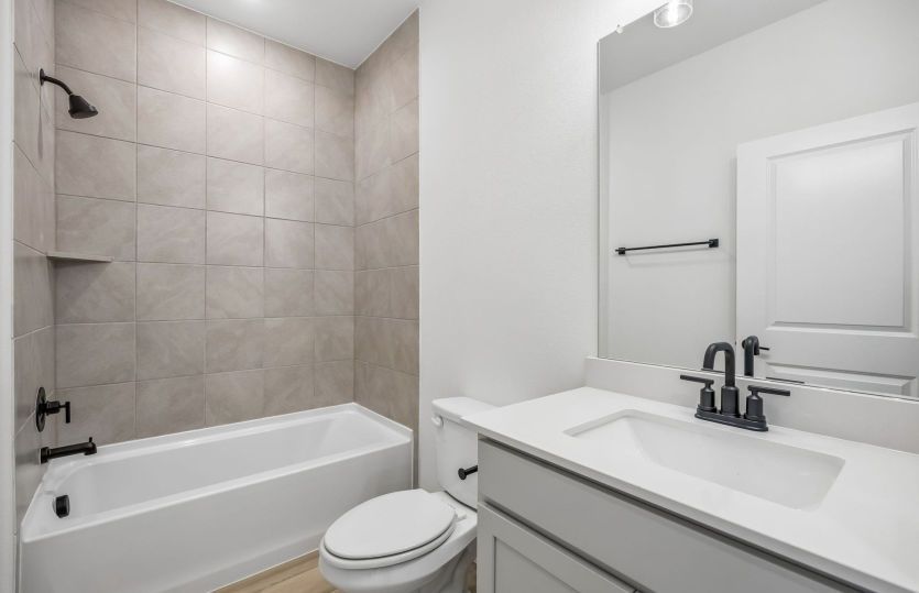 Secondary bath with tile surrounded shower