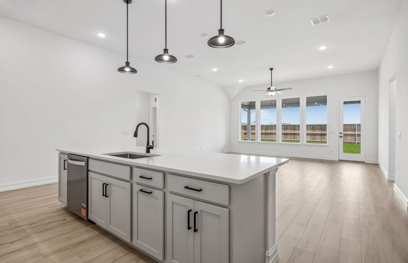 Spacious kitchen overlooking main gathering area