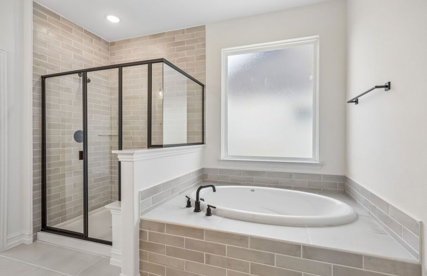 Separate tub and shower in owners suite