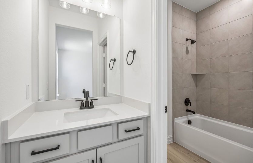 Secondary bath with tile surrounded shower