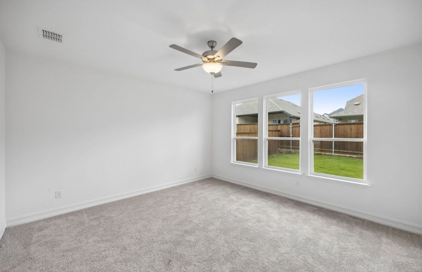 Primary suite with large windows