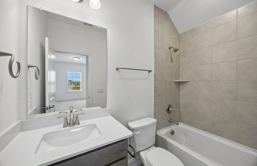 Secondary bath with tile surrounded shower