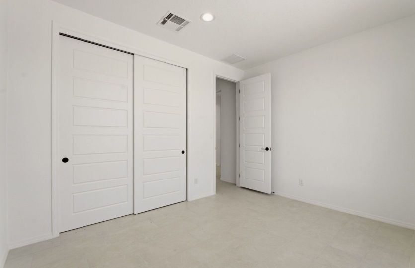 Comfortable secondary bedroom with spacious closet and versatile layout