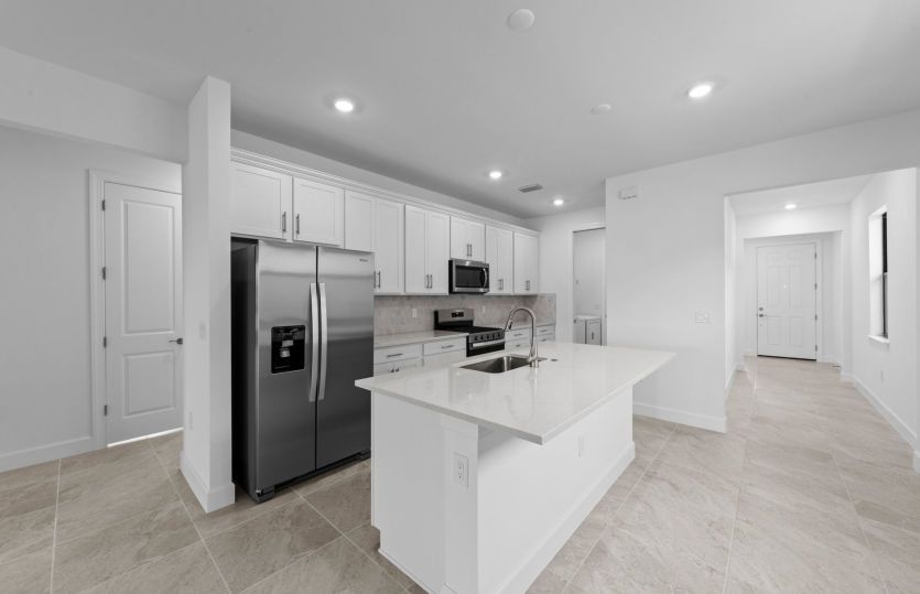 Large kitchen with stainless steel appliances
