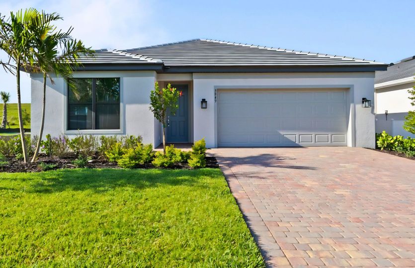 Welcoming exterior of this home with impact glass windows