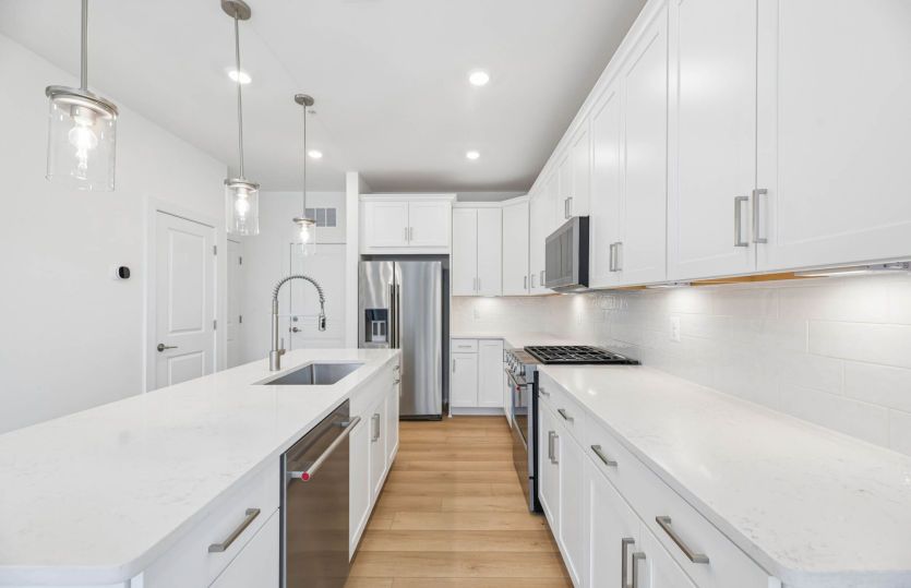 Kitchen Features Stainless Steel Appliances - Actual Home