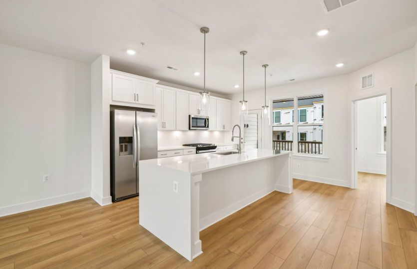 Kitchen Features an Expansive Island - Actual Home