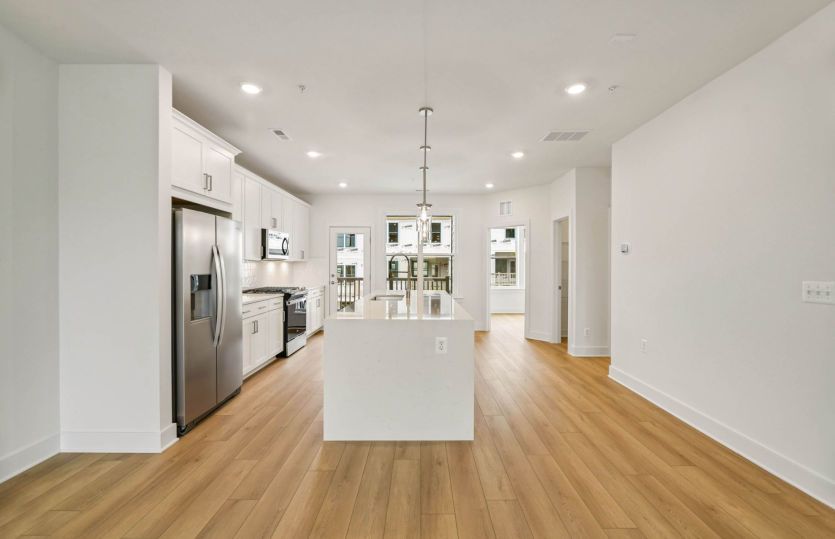 Rear Kitchen with Access to the Covered Balcony - Actual Home
