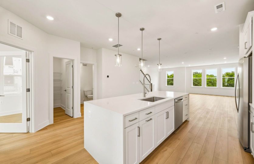 Kitchen Features White Cabinetry - Actual Home