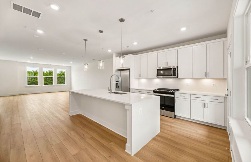 Kitchen Features a Tile Backsplash - Actual Home