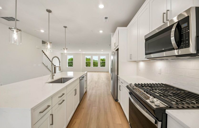 Kitchen Features Stainless Steel Appliances - Actual Home