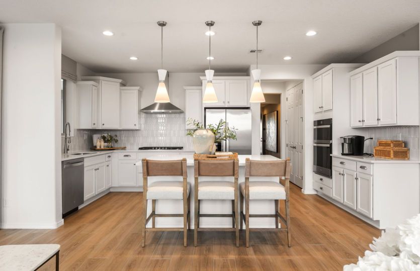The Ocotillo kitchen with our Chef package that includes staggered cabinetry and built-in appliances