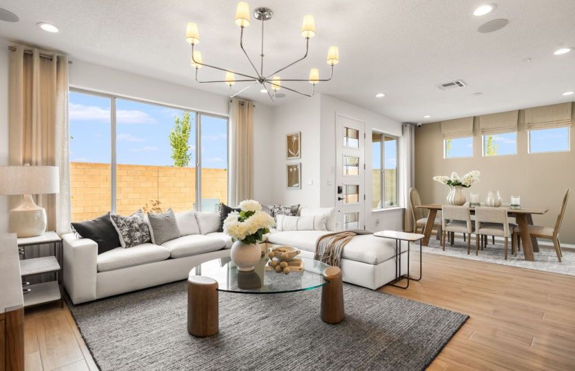 Gathering room offers space for ample seating, a bright window and overhead lighting.