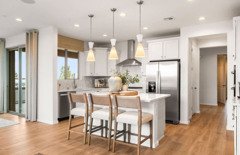 Over the island is the option to add a drop-down accent ceiling and pendant lights for an impressive
