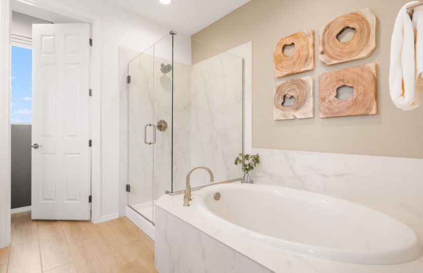 Unwind from the day in your dreamy tile bathtub in the owner's suite bath.