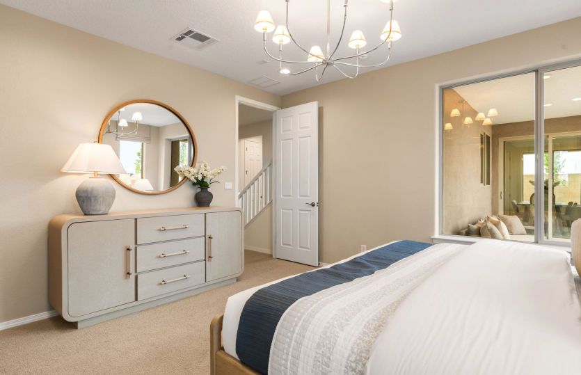 A bright window in the owner's suite can be replaced with a sliding glass door for access to the cov
