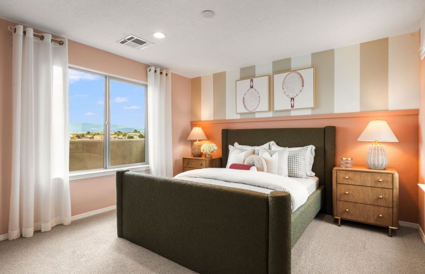 Bedroom 2 on the second floor with spacious closet and views out the bright window.
