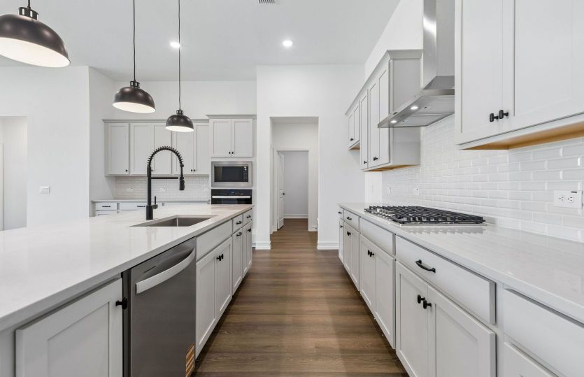 Beautiful kitchen with abundant cabinet space available *model representation