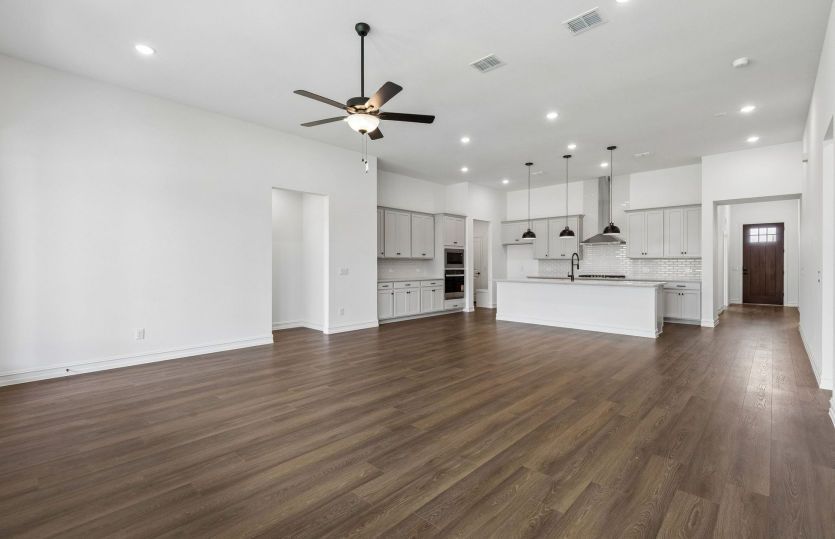 Spacious gathering room with beautiful flooring *model representation
