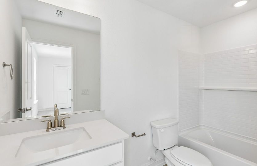 Secondary bath with tile surrounded shower