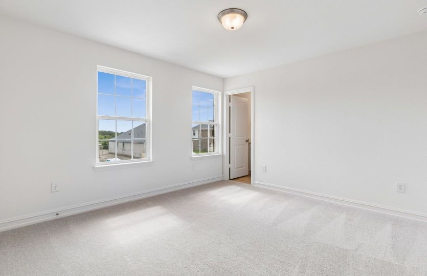 Secondary bedroom with large windows