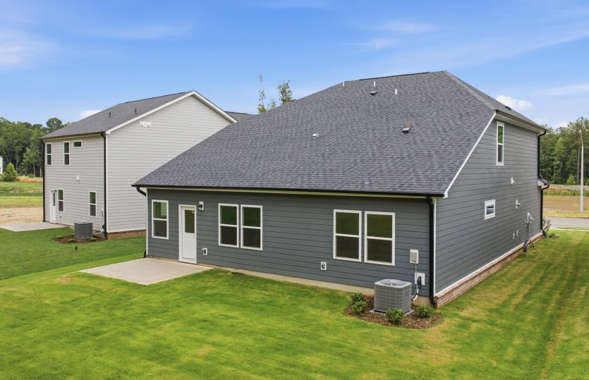 Kirby #104 - Back View Shows Outdoor Living Space & Large Yard