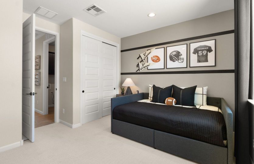 Bedroom 3 offers space for children or guests, with generous closet space.