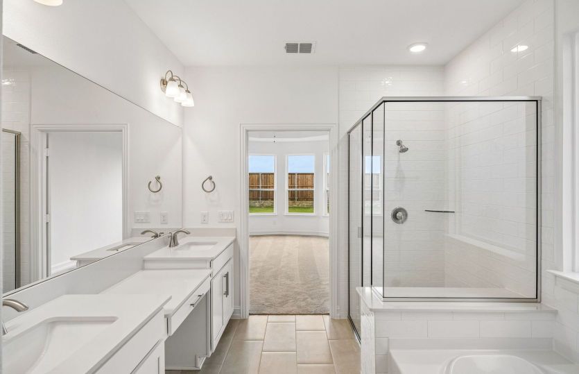 Double vanities in owners bath