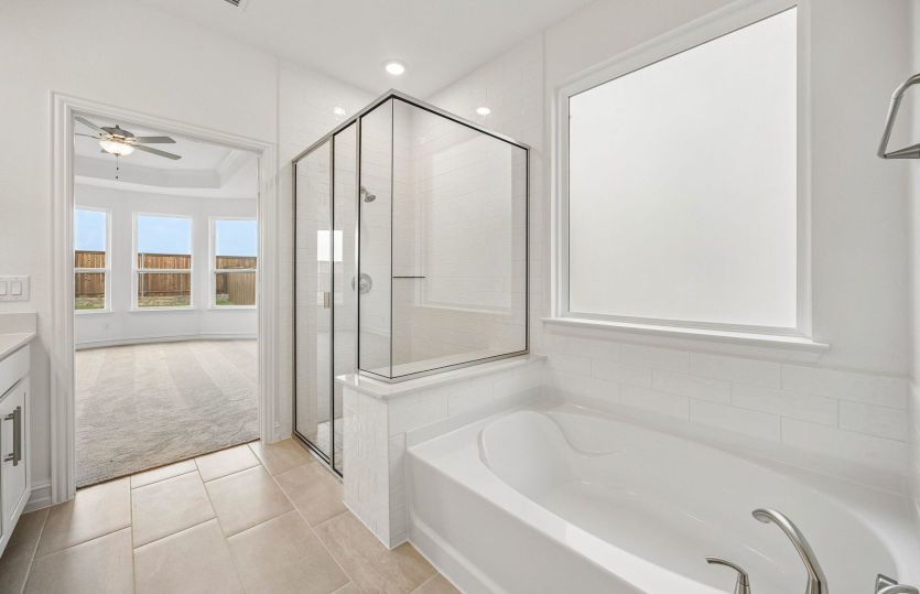 Separate tub and shower in owners suite