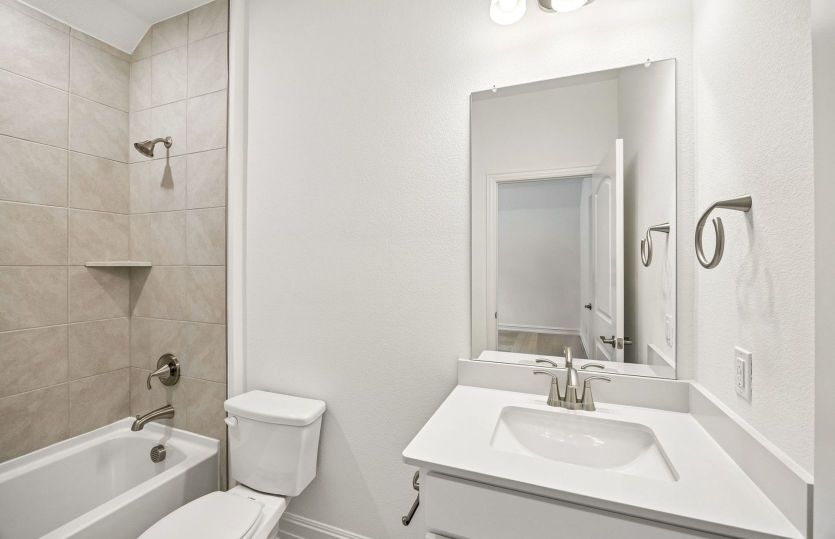 Secondary bath with tile surrounded shower