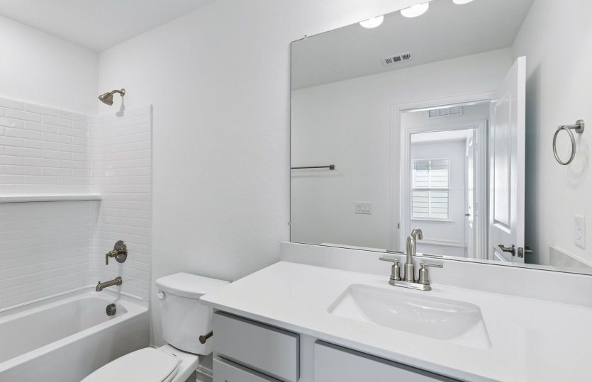 Secondary bath with tile surrounded shower