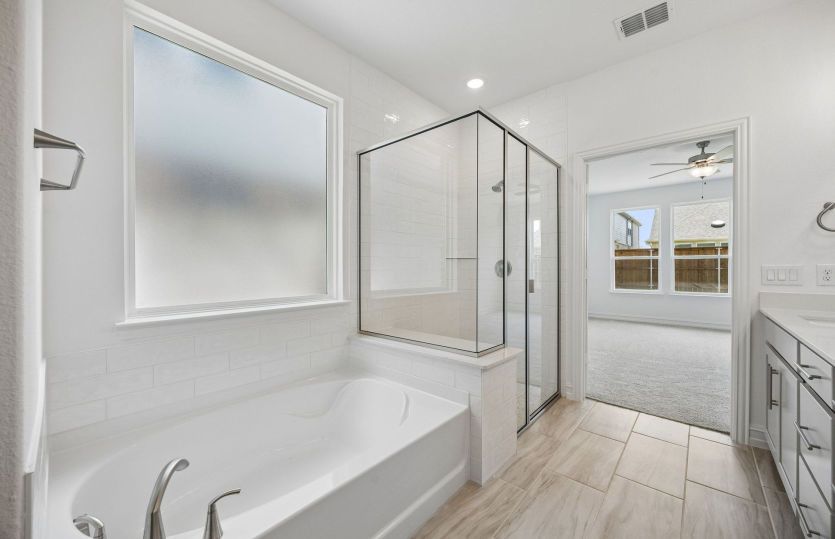 Separate tub and shower in owners bath