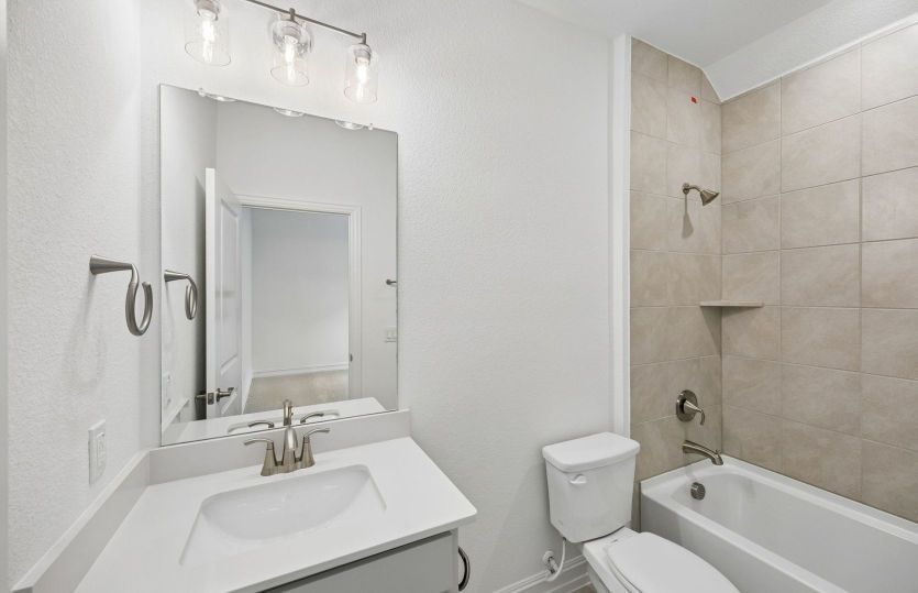 Secondary bath with tile surrounded shower