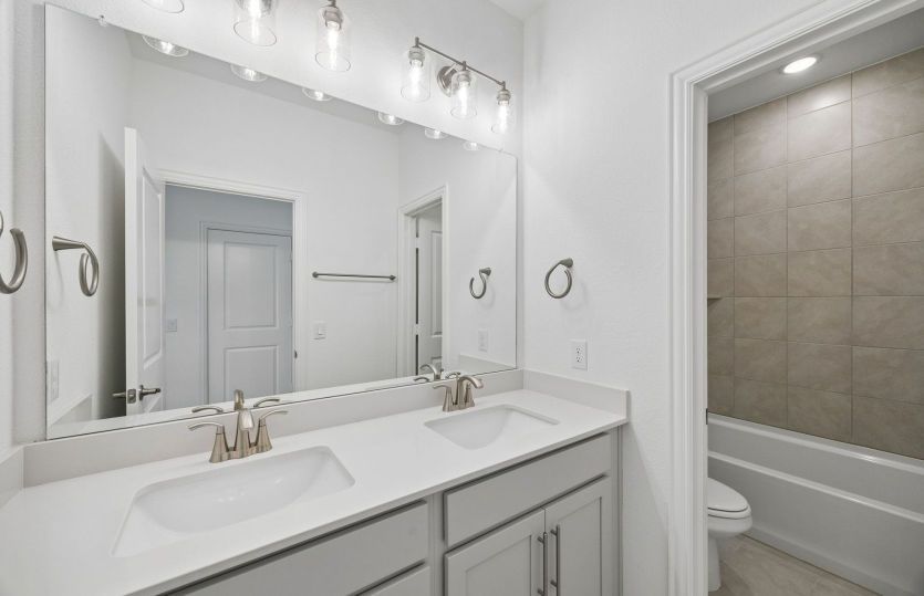 Secondary bath with tile surrounded shower