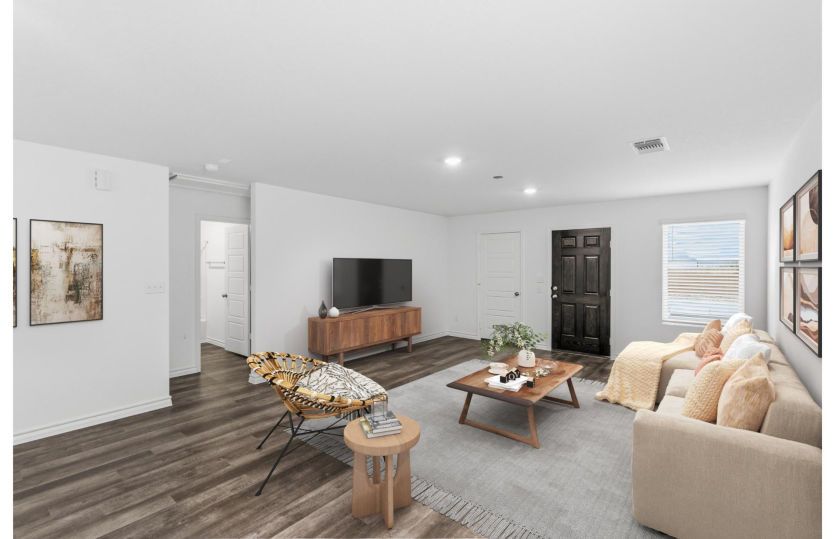 Gathering room with large window *photo depicts features that may vary in actual home