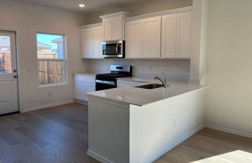 Spacious kitchen with access to backyard *some features may vary