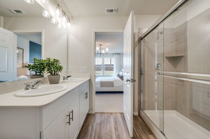 Owner's bath with large shower and double vanity