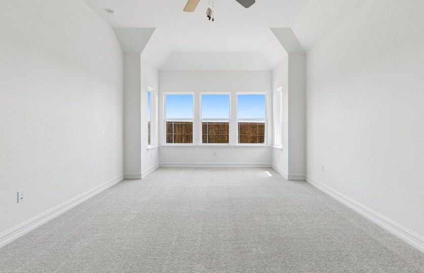 Owners suite with large windows shown