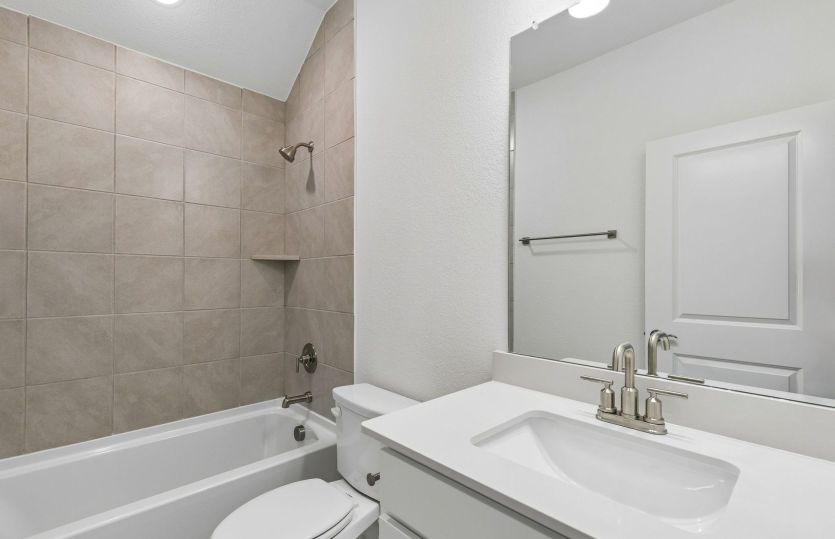 Secondary bath with beautiful tile surrounded shower