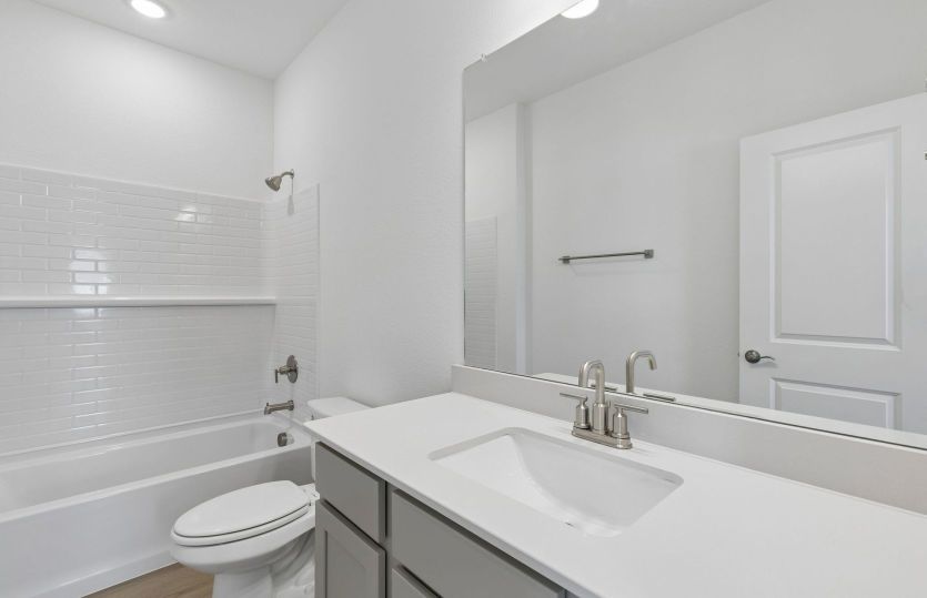 Secondary bath with tile surrounded shower