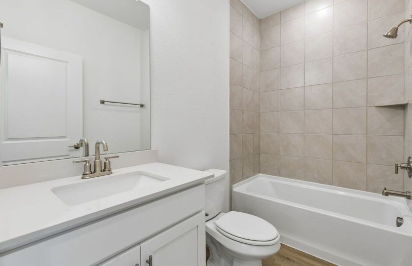 Secondary bath with tile surrounded shower