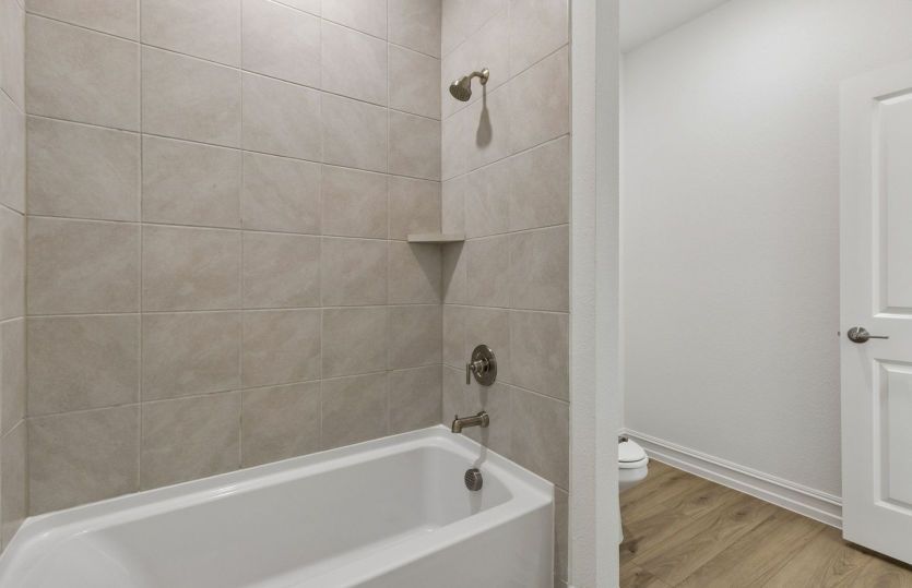 Secondary bath with tile surrounded shower