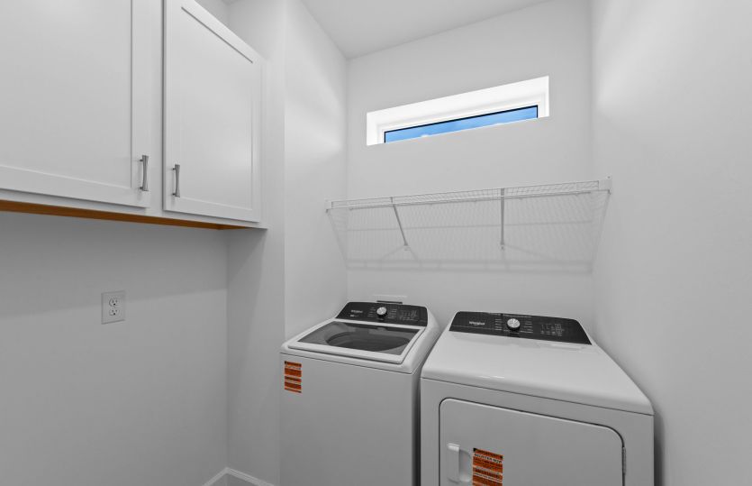 Laundry room with storage space