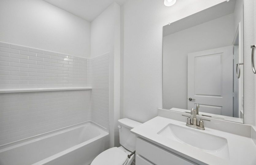 Secondary bath with tile surrounded shower