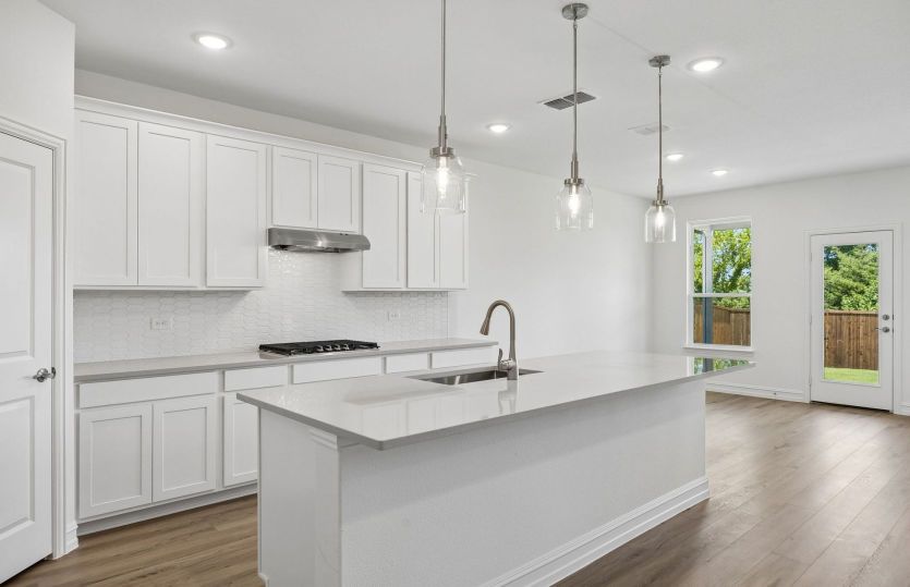 Kitchen with eat-in bartop island