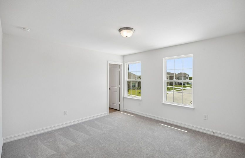 Secondary bedroom with large windows
